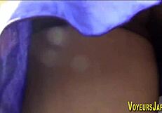 Asian babe feels excited as she's followed in public upskirt