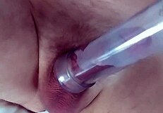 Guy with tail in ass pumps his dick close up