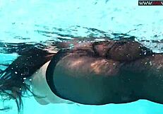 sexy chick swims naked in pool