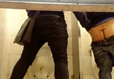 Intriguing gay sex encounter happening in the second toilet.