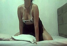 This perky ass prostitute is rubbing her pussy on a pillow in public.