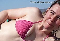 Boy Reads On Beach But She Surprises Him?