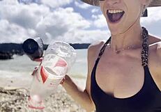 Pretty Babe Cleans Natural Beach at Pacific Ocean.