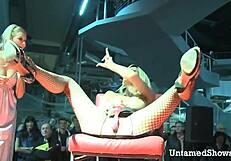 Look at this horny slut! She's spreading her legs, ripping clothes in a wild striptease at the sex show!