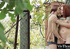 Lesbian redhead fingers a stranger's pussy in panties