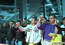 Look at this horny slut! She's spreading her legs, ripping clothes in a wild striptease at the sex show!