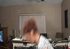 Redhead MILF in lingerie shows big tits and pussy while talking dirty with cock.