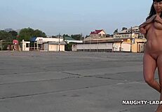 hey, check out this milf going nude and barefoot on the street