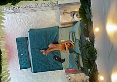 Monika fox poses naked on the bed.