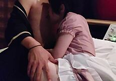 Petite Asian waitress in miniskirt serves erotic foot play with raw finish.