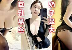 Black stockings make big tits look even larger in homemade clip