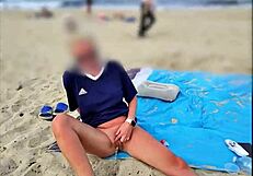 Missspisss shows big cock on Mallorca beach in public