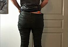 French amateur in leather pants and satin lingerie teases with heels and thong in POV