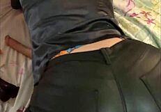 French amateur in leather pants and satin lingerie teases with heels and thong in POV