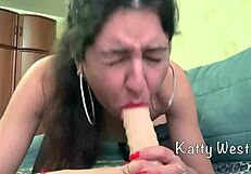 Katty West in stockings sucks and pounds dildo to a massive orgasm.