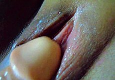 Asian Masturbates with Dildo