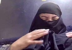 arab amateur milf flaunts big tits and squirts in hijab dress