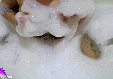 i love watching this cute babe suck that huge dildo in the bath