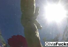 olivia, that blonde milf, is having summer fun masturbating nude in the pool!