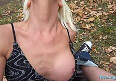 Tattooed busty German blonde MILF in public.