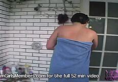 Two brunette hotties get cooled off in the shower with tan lines