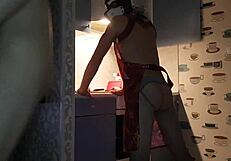 Asmodey and Jasper, the puppies, are cooking dinner together in the kitchen. They make quite a team!