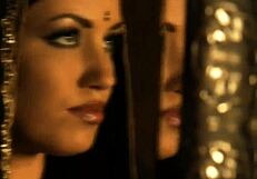 brunette babe dances nude to music