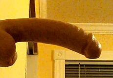 Can you believe this gay guy in hood deepthroating that dildo?