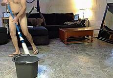 Horny gay nudist cleans his house while playing with anal toys