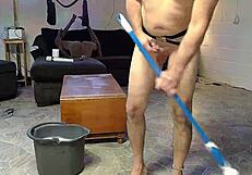 Horny gay nudist cleans his house while playing with anal toys