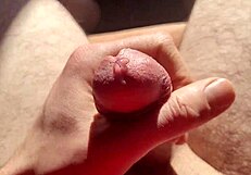 edging flaccid cock with precum in natural light