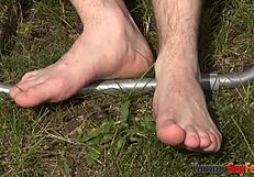 OH WOW, THE GAY TWINK TUGS THE HUNK'S FEET WITH HIS MOUTH IN THIS KINKY FETISH SCENE!