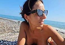 Caught between voyeurs, we stroke cocks on a public beach