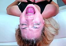 watch this blonde teen get her throat fucked upside down, leaving her face dripping with saliva in this intense session