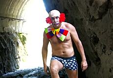 Hot Brunette Chained to Rock Fucked by Clown Outdoors