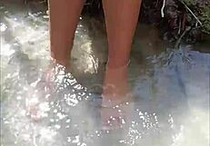 horny mexican puta flashes ass and pussy in small public river without fear.