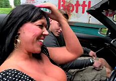 Horny huge tits cougar slut picks up a toy boy on the way back from shopping.