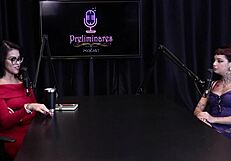 Annie Clementine humiliates in podcast with Bia Hot, handjob in see-through lingerie outdoors.