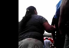 I watch my peruvian neighbor doing her shopping.