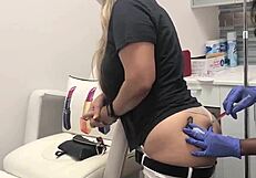 Blonde client with butt tattoo receives injection during spa massage session 2, watched voyeuristically