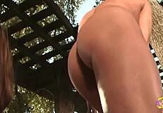 gorgeous thick lesbians use sex toy outdoors for mutual pleasure