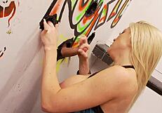 Blonde slutty milf grabs a massive cock from glory hole for fun