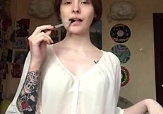 She took off her underwear on camera and showed a smooth pussy