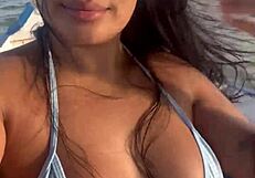Brazilian latina wife enjoys a relaxing boat ride in bikini