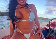 Brazilian latina wife enjoys a relaxing boat ride in bikini