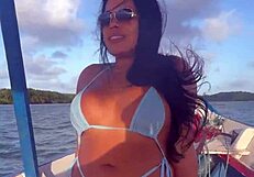 Brazilian latina wife enjoys a relaxing boat ride in bikini