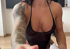 Sultry lady in black bodysuit dives into anal thrill with fisting