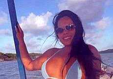 Brazilian latina wife enjoys a relaxing boat ride in bikini