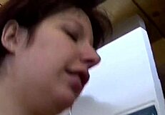 Titty slut fingers her tight pussy using a dildo while watching porn.