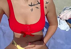 hot blondy playing with pussy on public beach